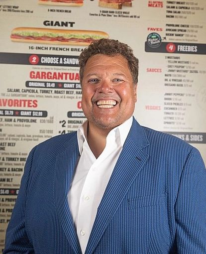 Jimmy John's CEO shot an elephant and took a selfie with its body